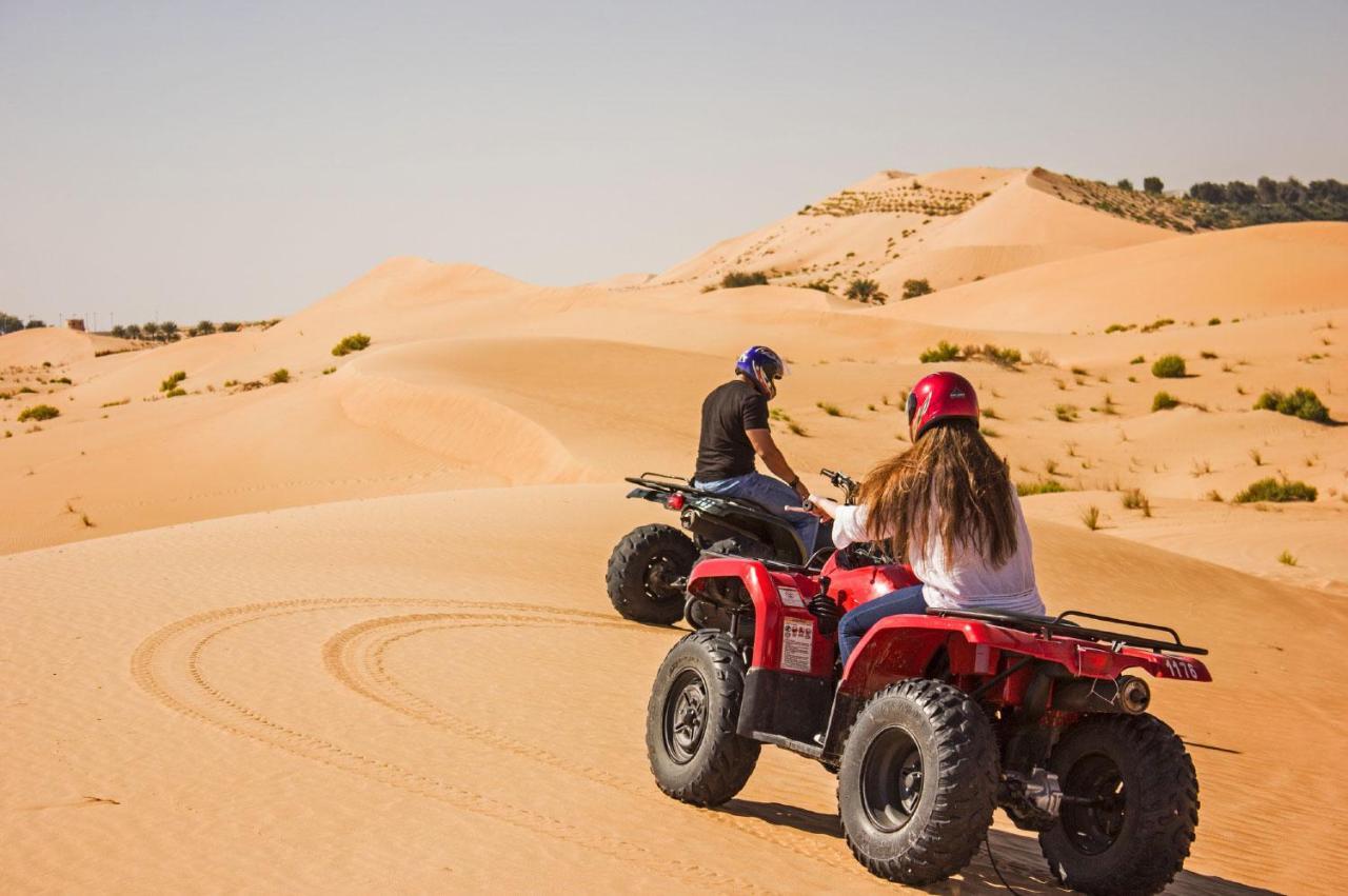 Telal Resort Al Ain Buitenkant foto Quad biking in the desert
